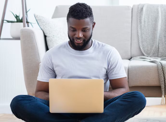 Man sitting using laptop